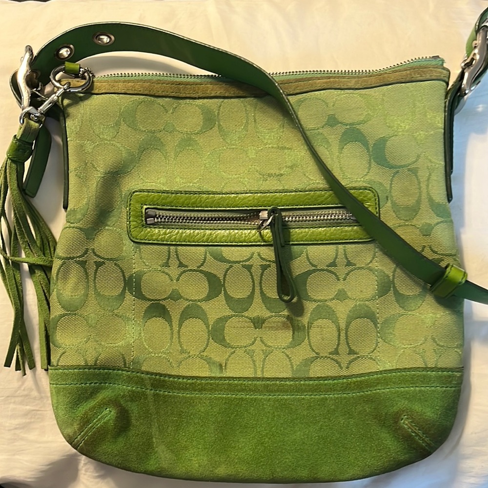 Coach green bag with adjustable leather strap. Original tassel and tag.